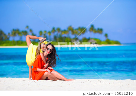 Mother and daughter enjoying time at tropical beach 55031210