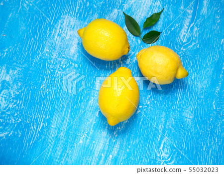 Lemons on blue background. 55032023