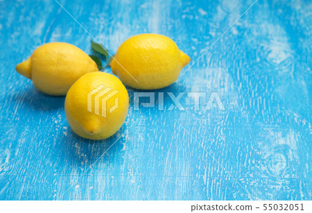 Lemons on blue wooden background. Lemons on blue wooden background. 55032051