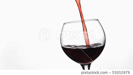 Rose wine. Red wine pour in wine glass over white background Rose wine. Red wine pour in wine glass over white background 55032979