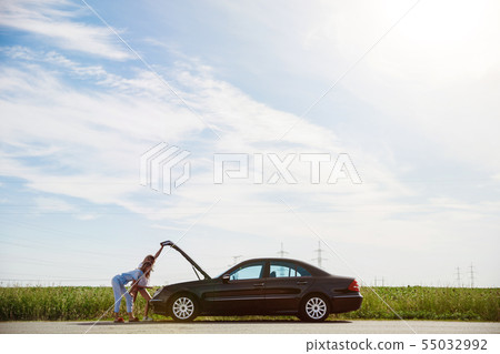 Young lesbian's couple going to vacation trip on the car in sunny day 55032992