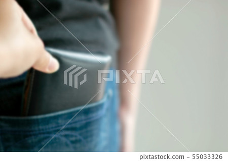 The pickpocket steal wallet out of jeans pocket. The pickpocket steal wallet out of jeans pocket. 55033326