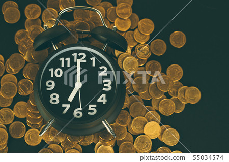 Alarm clock and coins stacks on working table, Alarm clock and coins stacks on working table, 55034574