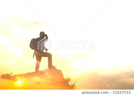 Silhouette of man hold up hands on the peak of Silhouette of man hold up hands on the peak of 55037533