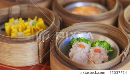 Bamboo Steamers with dim sum steamers. Bamboo Steamers with dim sum steamers. 55037714