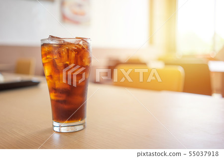 Glass of soft drinks placed on the table gives a Glass of soft drinks placed on the table gives a 55037918