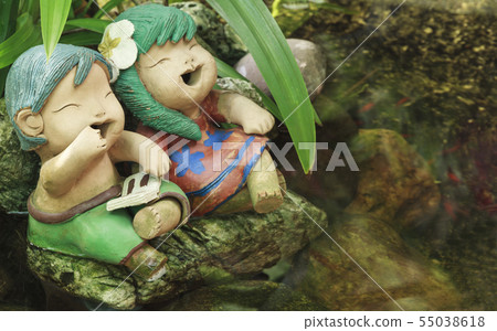 Smiling Boy and Girls Doll Sitting in Garden. Smiling Boy and Girls Doll Sitting in Garden. 55038618