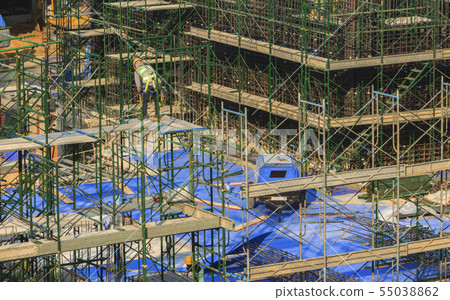 Builder worker in safety protective equipment. Builder worker in safety protective equipment. 55038862