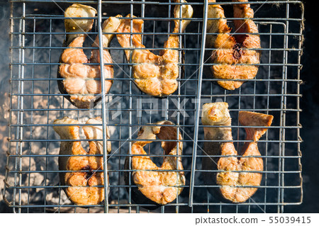 Grill the fish on the fire. Salmon Grill the fish on the fire. Salmon 55039415