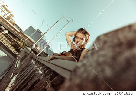 Good-looking young photo model touching her hair 55041636