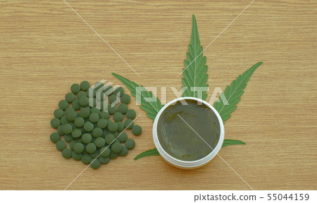 Cream cannabis and tablets medical capsules or pills hemp and leaf cannabidiol CBD harvested dried Cream cannabis and tablets medical capsules or pills hemp and leaf cannabidiol CBD harvested dried 55044159