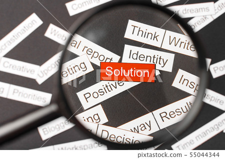 Magnifier glass over the red inscription solution 55044344