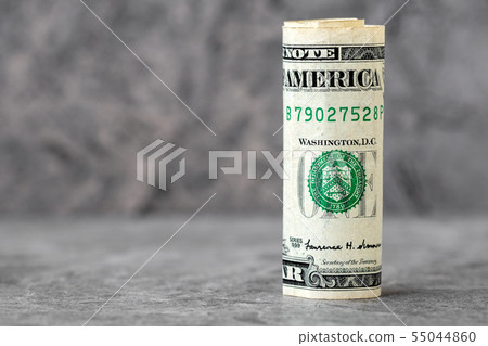 Rolled american dollar banknote 55044860
