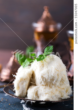 Traditional Turkish cotton candy Pismaniye in vintage plate close up. Traditional Turkish cotton candy Pismaniye in vintage plate close up. 55047005