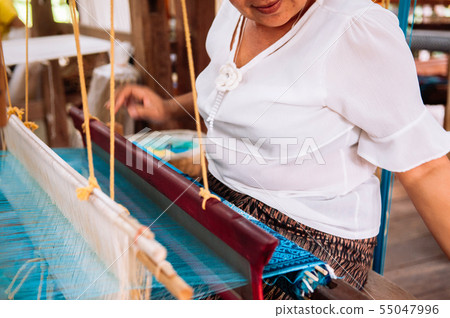 Asian Woman working on Vintage Laos style wooden Asian Woman working on Vintage Laos style wooden 55047996