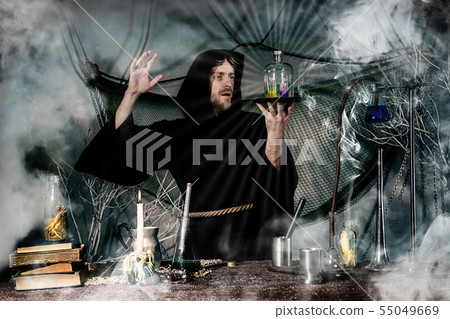The medieval alchemist make magic ritual  55049669