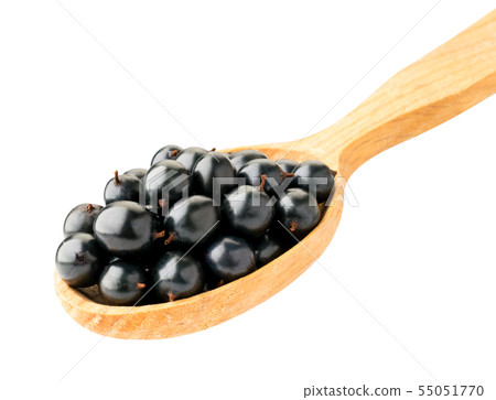 Black currant in wooden spoon isolated on a white Black currant in wooden spoon isolated on a white 55051770