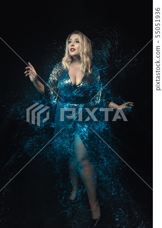 Woman surrounded mix lights effect. Full lenght. 55051936