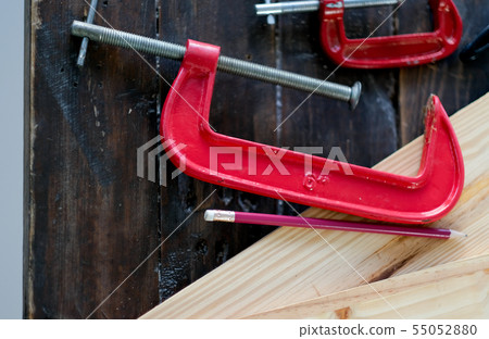 Close up view of red clamp tool for wood crafting 55052880