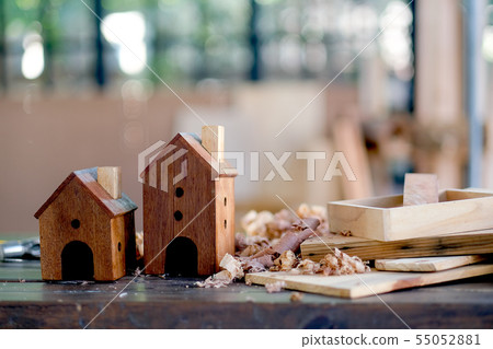 Two small wood houses or bird box are on table Two small wood houses or bird box are on table 55052881