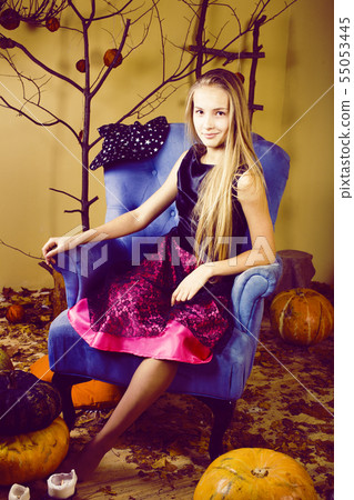 young pretty teenage girl in halloween holiday decorated interior happy smiling, lifestyle people young pretty teenage girl in halloween holiday decorated interior happy smiling, lifestyle people 55053445
