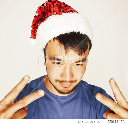 funy exotical asian Santa claus in new years red hat smiling funy exotical asian Santa claus in new years red hat smiling 55053451