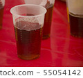 Hot tea in a plastic disposable cup  55054142