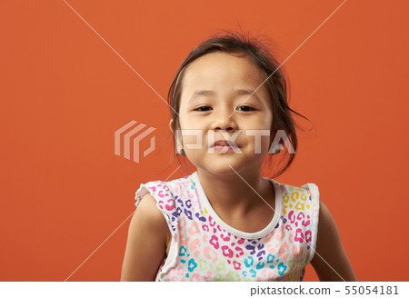 Asian kid being serious 55054181