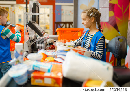 Girl in uniform at the cash register, playroom 55054318