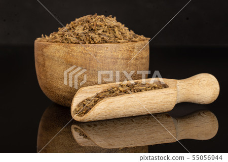 Dry caraway fruit isolated on black glass 55056944
