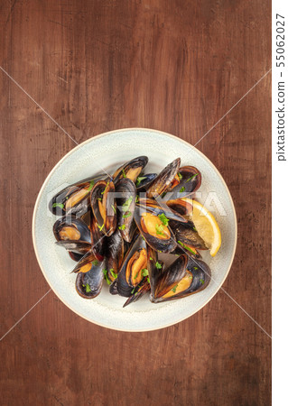 Marinara mussels, moules mariniere, shot from the top on a rustic background Marinara mussels, moules mariniere, shot from the top on a rustic background 55062027