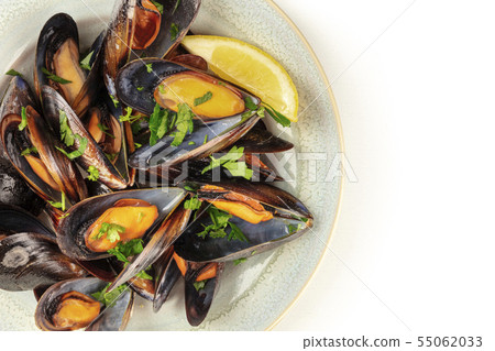 Marinara mussels, moules mariniere, close-up overhead shot on a white background Marinara mussels, moules mariniere, close-up overhead shot on a white background 55062033