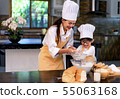 Happy asian family in the kitchen.Mother and son h 55063168