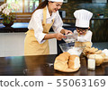 Happy asian family in the kitchen.Mother and son h 55063169