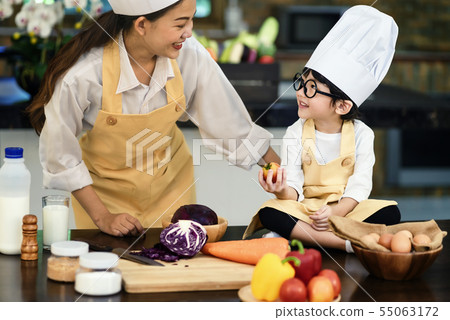 Happy asian family in the kitchen.Mother and son h 55063172