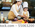 Happy asian family in the kitchen.Mother and son h 55063200