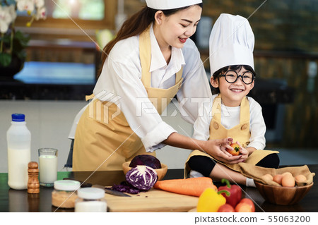 Happy asian family in the kitchen.Mother and son h 55063200