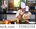 Happy asian family in the kitchen.Mother and son h 55063204