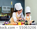 Happy asian family in the kitchen.Mother and son h 55063206