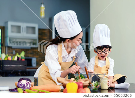 Happy asian family in the kitchen.Mother and son h 55063206