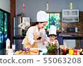 Happy asian family in the kitchen.Mother and son h 55063208