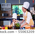 Happy asian family in the kitchen.Mother and son h 55063209