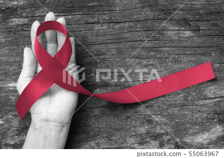 Burgundy ribbon awareness symbolic concept Burgundy ribbon awareness symbolic concept 55063967