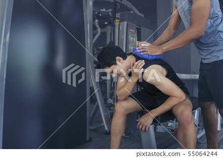 Handsome young man who is feeling pain from 55064244