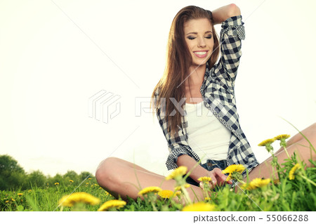 Portrait of young beautiful brunette woman  55066288