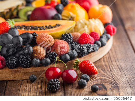 Fresh raw organic summer berries and exotic fruits Fresh raw organic summer berries and exotic fruits 55066447