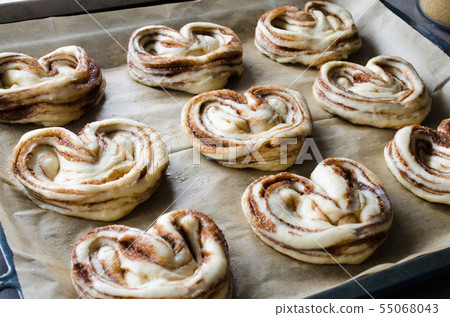 Raw unbaked buns. Ready to bake homemade Raw unbaked buns. Ready to bake homemade 55068043