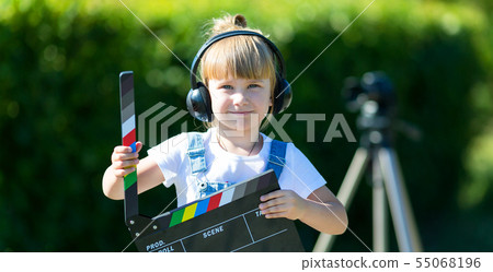Portrait of a child with a TV clapper. Television  55068196