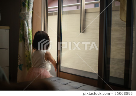 Girl trying to get out on the veranda Girl trying to get out on the veranda 55068895