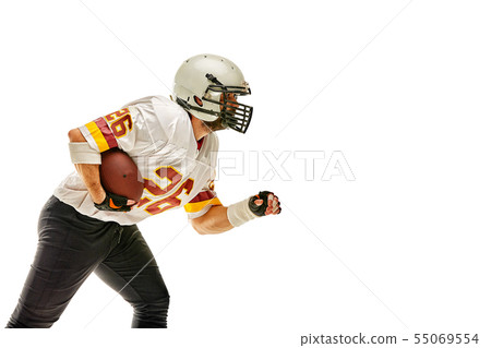 American football player posing with ball on black background. Super Bowl concept. Concept American 55069554